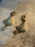 Green Songjin ear-rings worn in a traditional Chinese interior